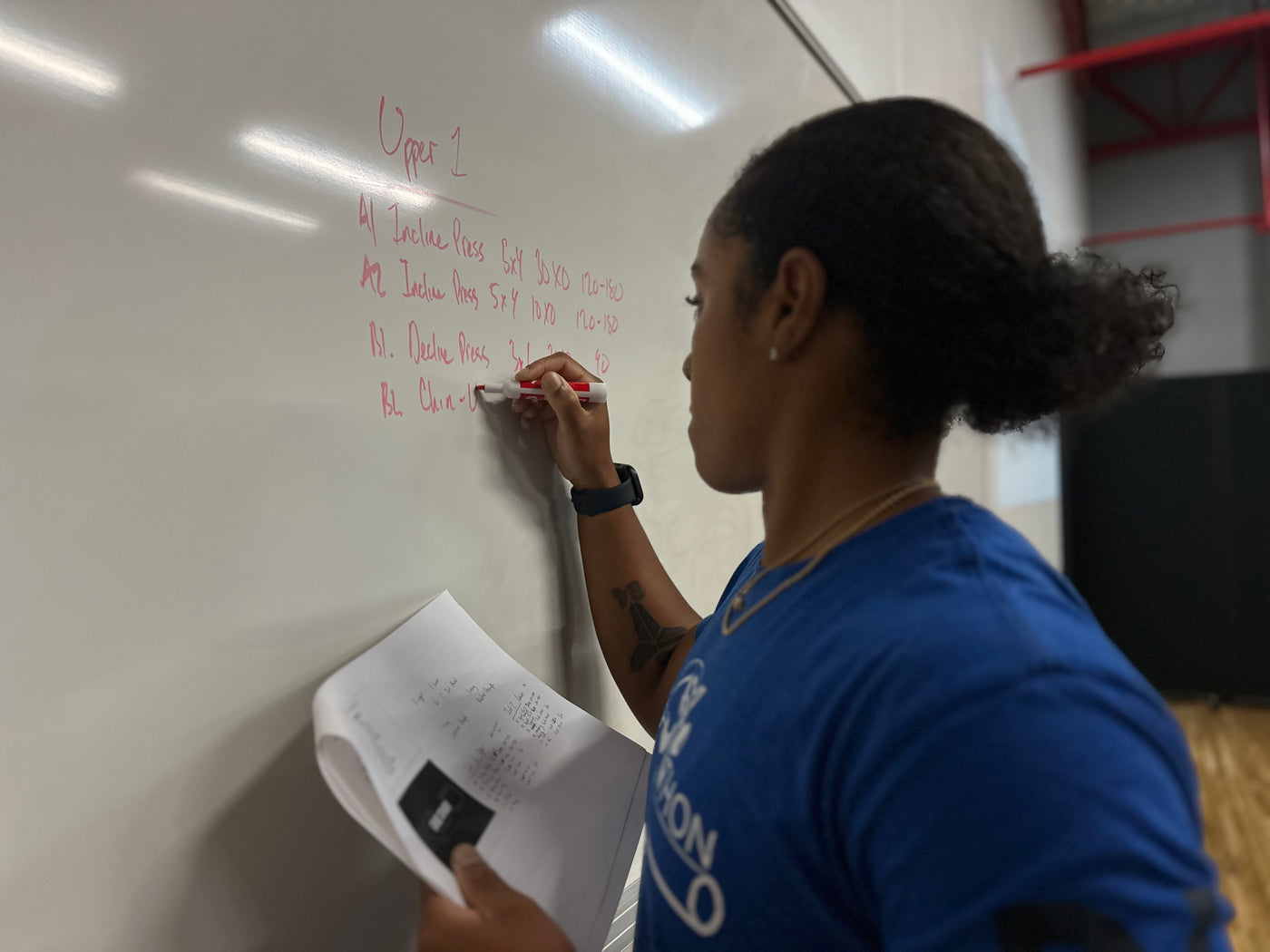 A coach working through programming notes